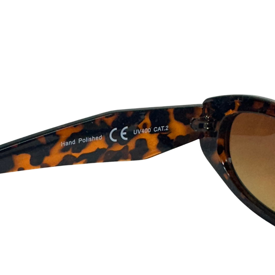 Brown tortoiseshell oval sunglasses