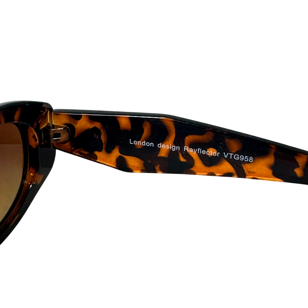 Brown tortoiseshell oval sunglasses